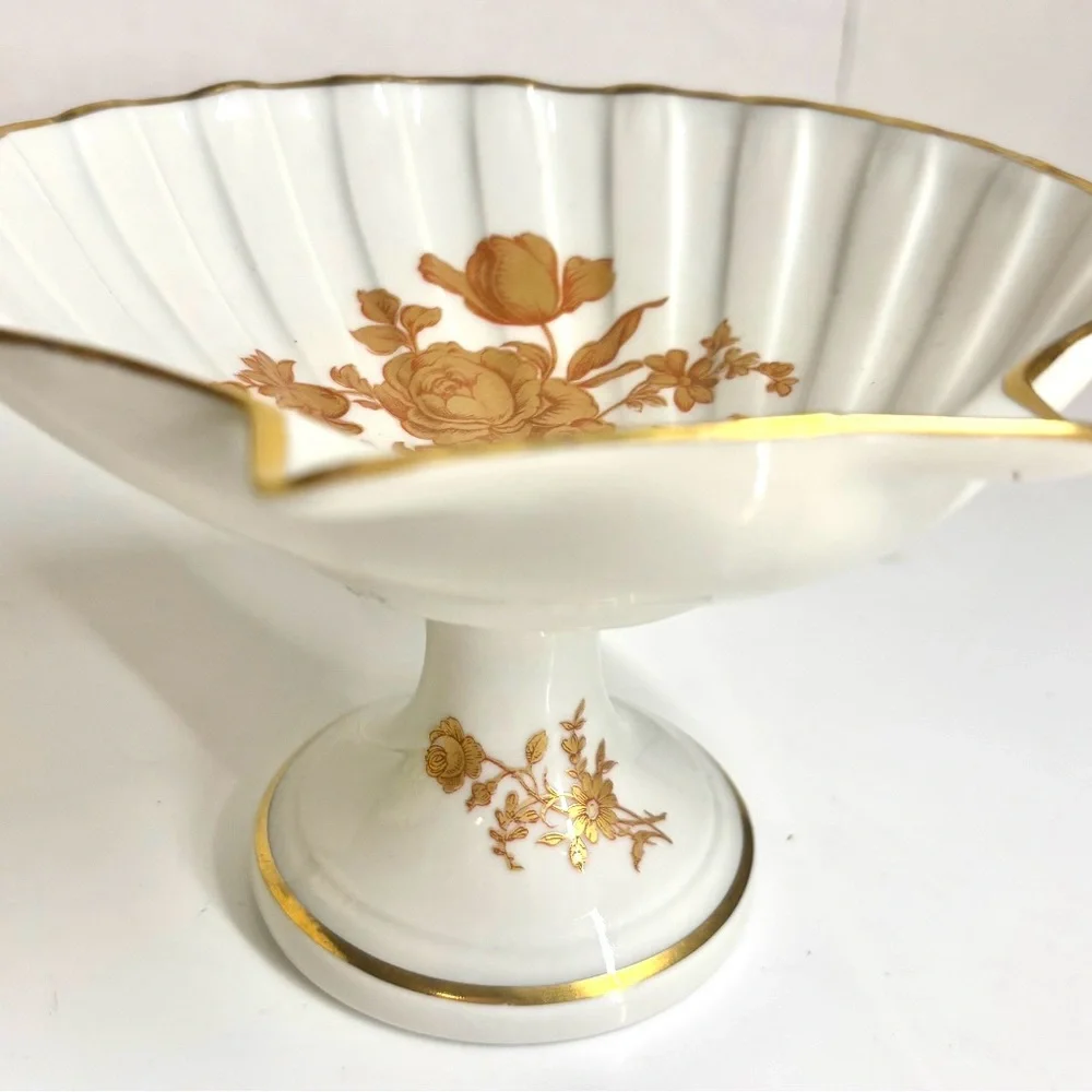Vintage Limoges France porcelain shell-shaped pedestal dish.